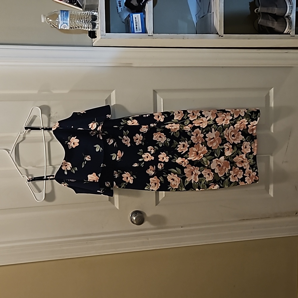 Form-fitting Formal floral dress with straps and off the shoulder ruffle.